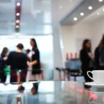 Close up of a coffee cup sitting on a table at a corporate event
