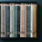 Neutral colored pencils laid on on a table
