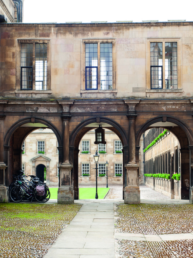 View looking on to a terraced quad with an old building adjacent to it.